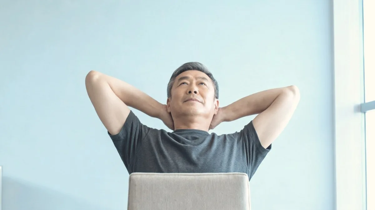 Thoracic extension over the back of a chair with hands behind the head
