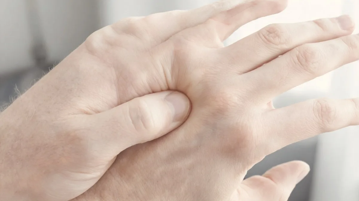 Pressing the LI 4 point in the web between thumb and index finger